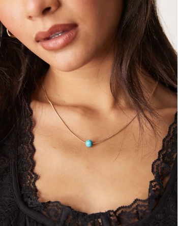 snake chain necklace with turquoise bead pendant in gold